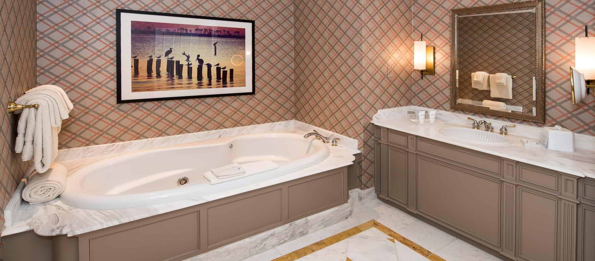 beau-rivage-hotel-cypress-suite-bathroom-hot-tub.jpg.image.2480.1088.high
