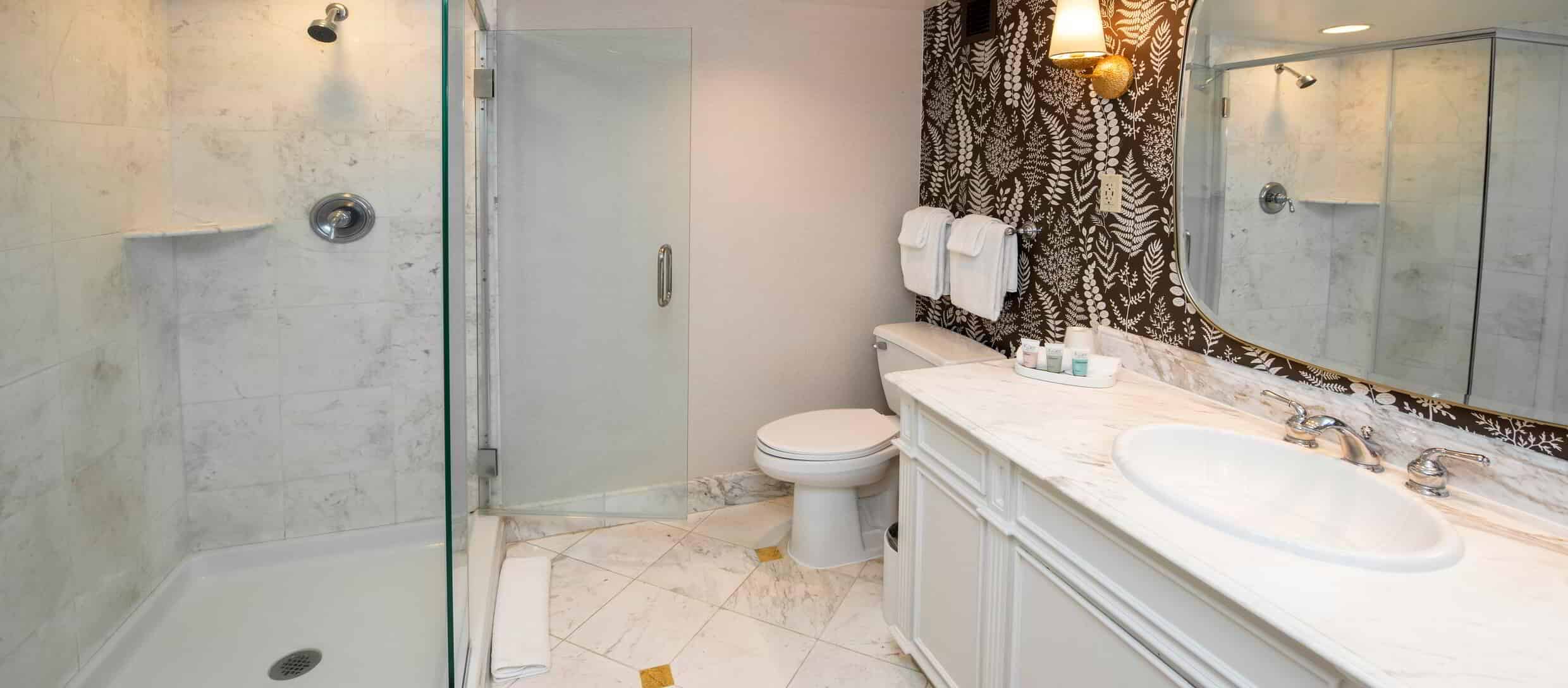 beau-rivage-hotel-deluxe-bathroom-walk-in-shower.jpg.image.2480.1088.high